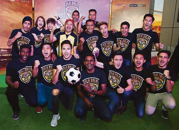 The Ola Bola Malaysian football team. Chiu is in red cap and Luqman is kneeling second from right.