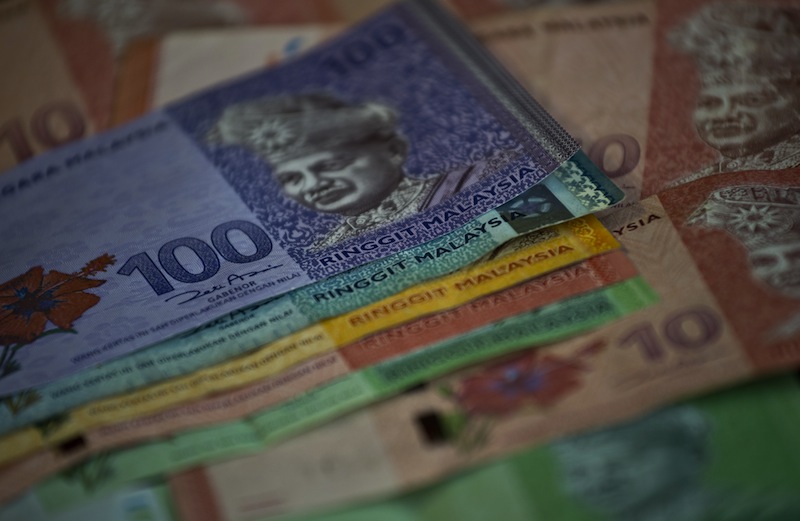 This photo illustration shows Malaysian ringgit banknotes in Kuala Lumpur on June 29, 2015. u00e2u20acu201d AFP pic