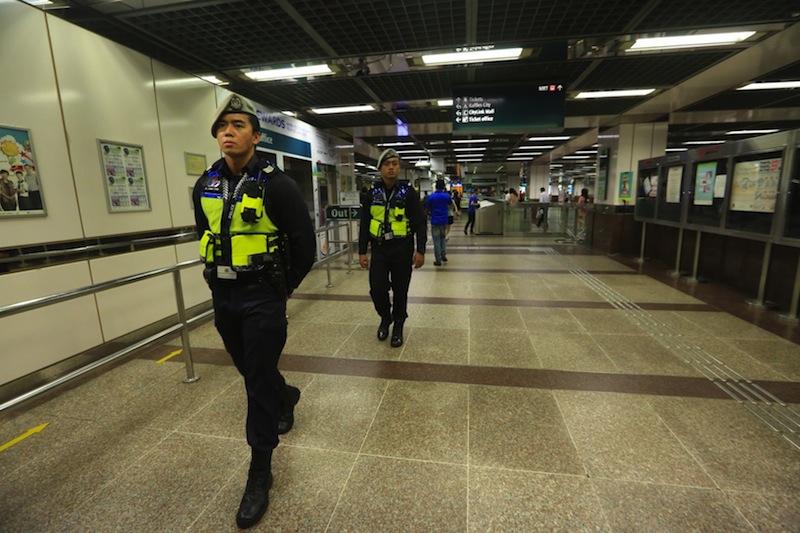 Police patrolling City Hall MRT station on Jan 15. u00e2u20acu201d TODAY pic