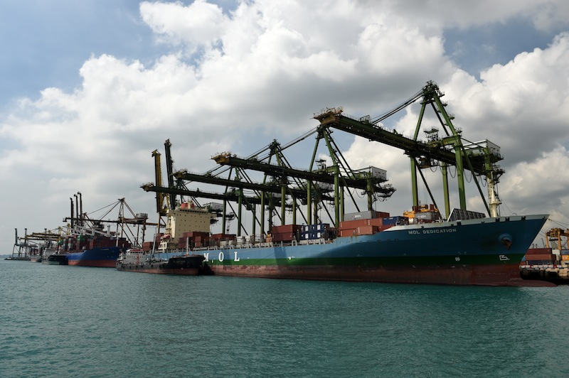 Container vessels dock at Keppel port terminal in Singapore on January 18, 2016. u00e2u20acu201d AFP pic