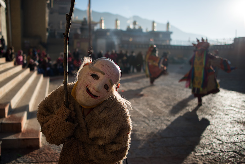 This picture taken on January 5, 2016 at the Ganden Sumtsenling Monastery in Shangri-La, Diqing Tibetan Autonomous Prefecture of southwest Chinau00e2u20acu2122s Yunnan Province, shows a lama wearing a mask during the Gedong festival. u00e2u20acu201d AFP pic