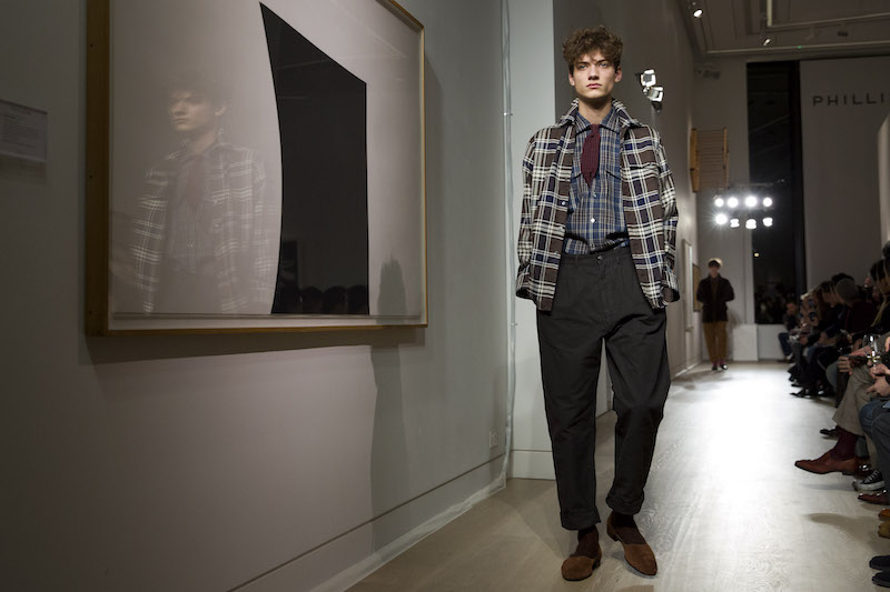 A model presents a look from the Dunhill 2016 fall/winter collection by John Ray. u00e2u20acu201d AFP pic