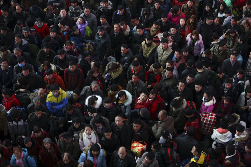 Passengers wait to board a train at a railway station, in Ningbo, Zhejiang province, China, January 30, 2016. u00e2u20acu201d Reuters pic