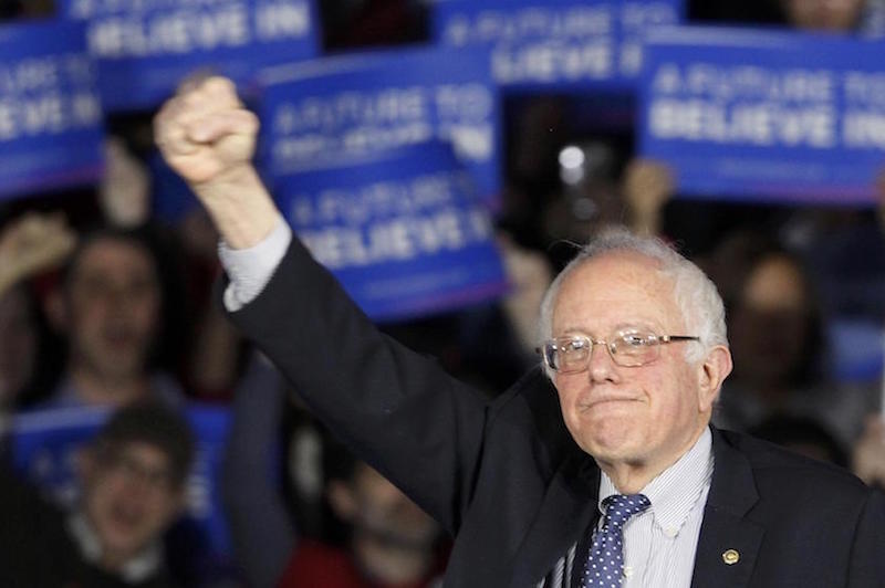 US Democratic presidential candidate Bernie Sanders raises a fist as he speaks at his caucus night rally Des Moines, Iowa, February 1, 2016. u00e2u20acu201d Reuters pic