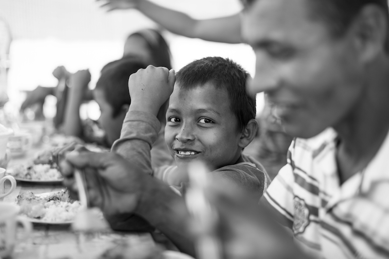 Together with his father, siblings and cousins, this young Colombian refugee gets a taste of home from his auntu00e2u20acu2122s cooking. u00e2u20acu201d Picture by Chris Terry via Reuters