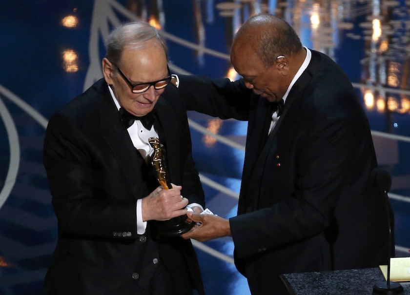 Composer Ennio Morricone accepts the Oscar for Best Original Score for u00e2u20acu02dcThe Hateful Eightu00e2u20acu2122 from presenter Quincy Jones (right) at the 88th Academy Awards in Hollywood, California February 28, 2016. u00e2u20acu201d Reuters pic