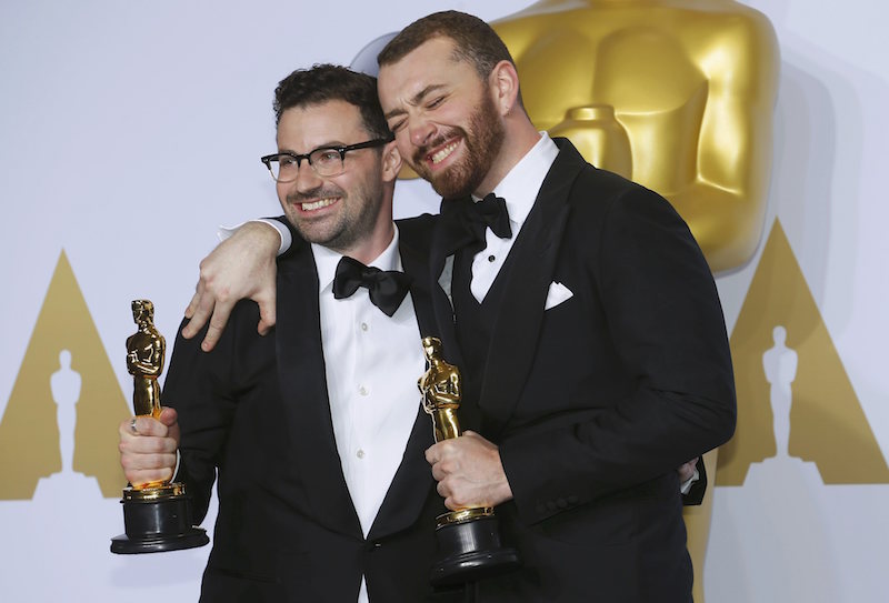 Jimmy Napes and Sam Smith, winners for Best Original Song for u00e2u20acu02dcWriting's on the Wallu00e2u20acu2122 from the film u00e2u20acu02dcSpectreu00e2u20acu2122, pose with their Oscars backstage during the 88th Academy Awards in Hollywood, California February 28, 2016. u00e2u20acu201d Reuters pic