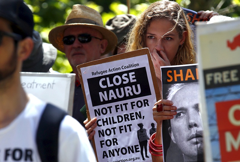 A protester holds a placard during a rally in support of refugees in central Sydney, Australia, in this file picture taken on October 19, 2015. u00e2u20acu201d Reuters pic