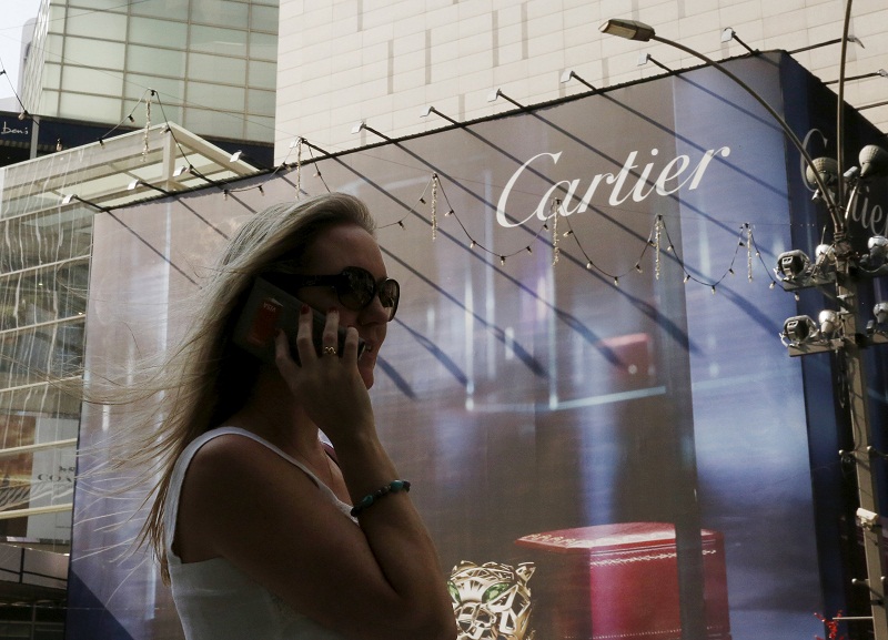 A woman talks on the phone in the main shopping district of Kuala Lumpur on February 18, 2016. u00e2u20acu201d Reuters pic