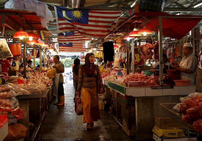 A woman shops in a wet market in Kuala Lumpur on February 18, 2016. u00e2u20acu201d Reuters pic