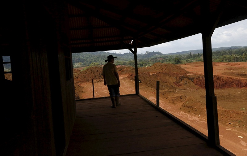 Durian planter Che Long Che Ali stands on the verandah of an abandoned house once in a durian orchard, now mined by bauxite mining companies in Kuantan February 16, 2016. u00e2u20acu201d Reuters pic