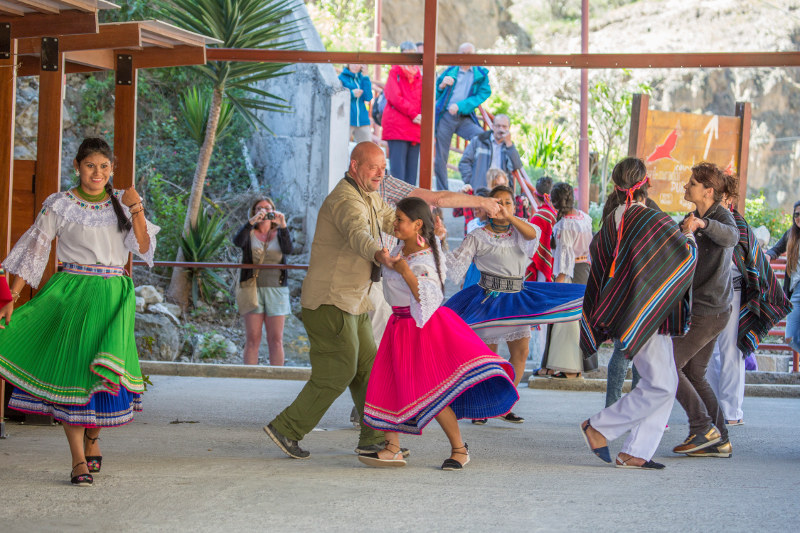 Wuayra Loma, an indigenous dance group, entertains passengers at the train station in Nariz del Diablo, Ecuador.