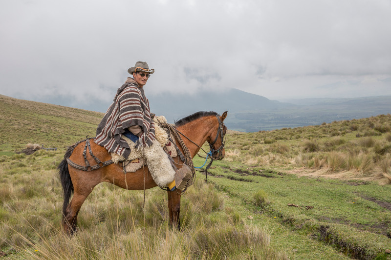 A horseback ride from Hacienda el Porvenir toward a view of the Cotopaxi Volcano in Ecuador.