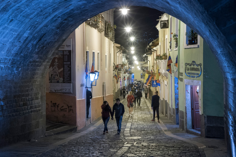 People walk along La Ronda, a street in the historic centre of Quito, Ecuador.