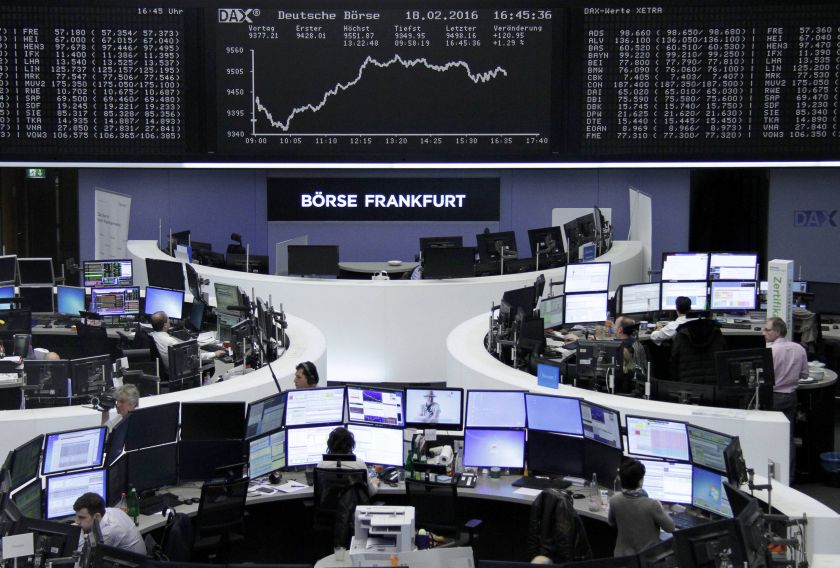 Traders work at their desks in front of the German share price index, DAX board, at the stock exchange in Frankfurt, Germany, February 18, 2016. u00e2u20acu201d Reuters pic