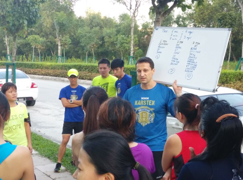 Karsten Kobel giving some pointers to runners at the clinic. u00e2u20acu2022 Picture by Azrul Khalib