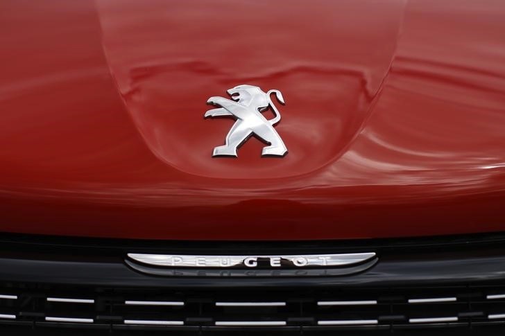 A logo is pictured on a Peugeot 208 car parked at the PSA Peugeot Citroen plant in Poissy, near Paris, France, April 29, 2015. u00e2u20acu201d Reuters pic