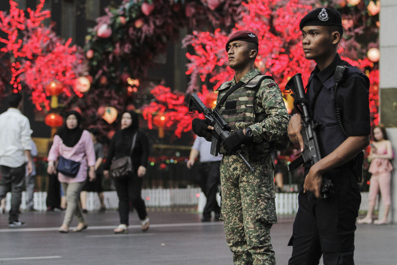 Police and armed forces personnel are seen patrol around the Pavilion in Kuala Lumpur February 22, 2016. u00e2u20acu201d Picture by Yusof Mat Isa