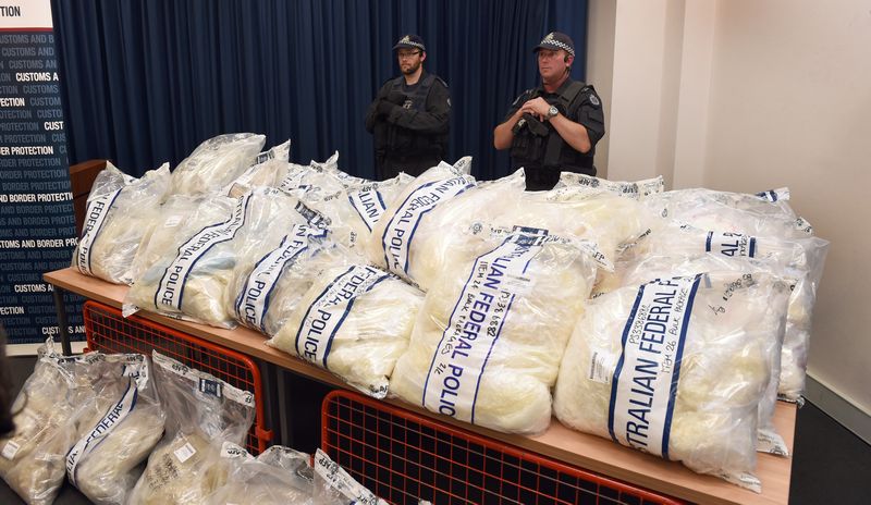 Australian police stand guard over some of the seized drugs in Sydney on November 29, 2014. Police scored another major drug bust of more that A$1 biilion, February 15, 2016. u00e2u20acu201d AFP pic