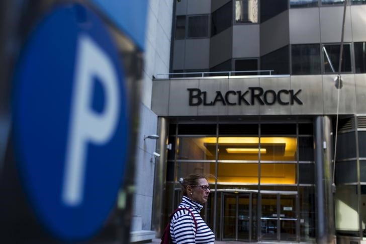 A woman walks next to a BlackRock sign pictured in the Manhattan borough of New York, October 11, 2015. u00e2u20acu201d Reuters pic