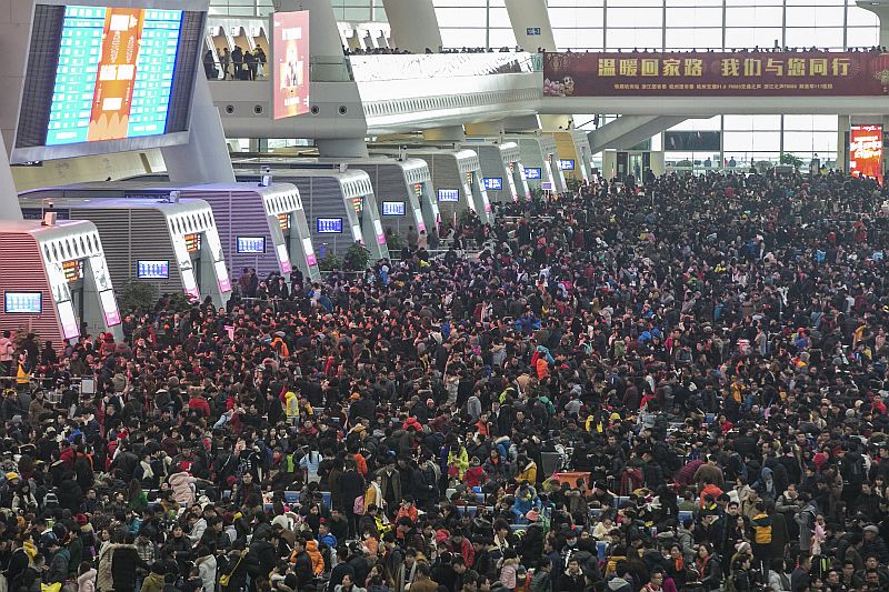 Passengers crowd at the waiting hall inside a railway station after trains were delayed due to heavy snow, during the travel rush ahead of the upcoming Spring Festival, in Hangzhou, Zhejiang province February 1, 2016. u00e2u20acu201d Reuters pic