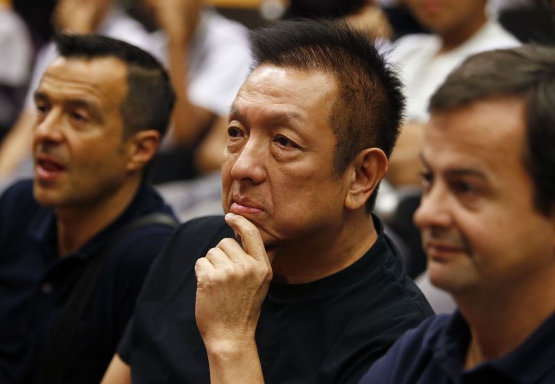 Valencia owner Peter Lim (centre) listens as Mourinho speaks with students of NorthLight School.