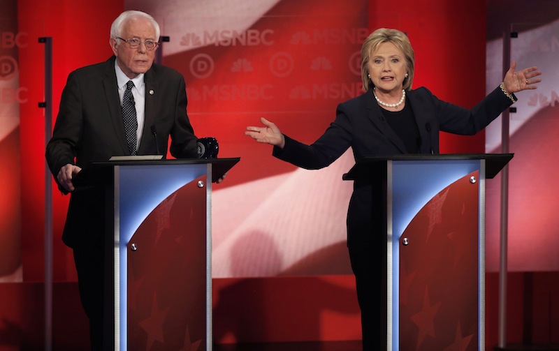 Bernie Sanders listens as Hillary Clinton speaks at the University of New Hampshire in Durham, New Hampshire, February 4, 2016. u00e2u20acu201d Reuters pic