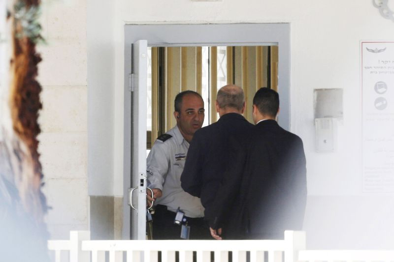 Former Israel Prime Minister Ehud Olmert (C) enters Maasiyahu prison near Ramle, south of Tel Aviv, February 15, 2016. REUTERS/Nir Elias