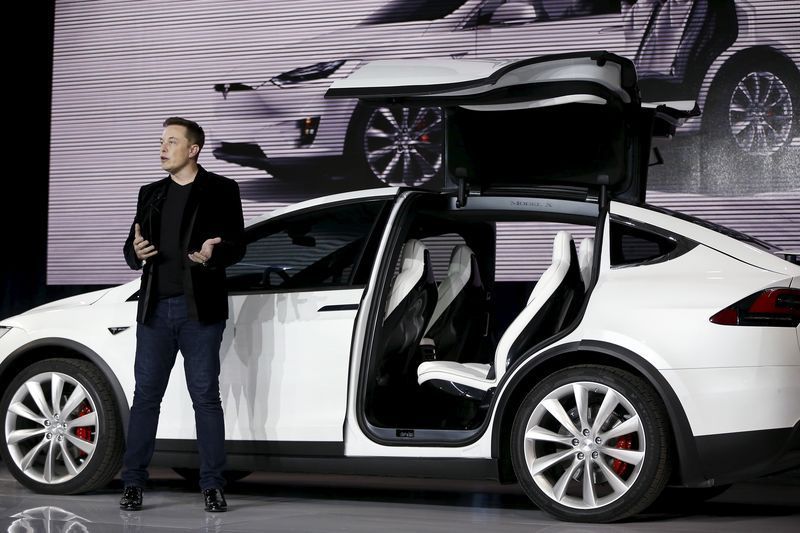 Tesla Motors CEO Elon Musk introduces the falcon wing door on the Model X electric sport utility vehicles at a presentation in Fremont, California, in this September 29, 2015, file photo. REUTERS/Stephen Lam/Files