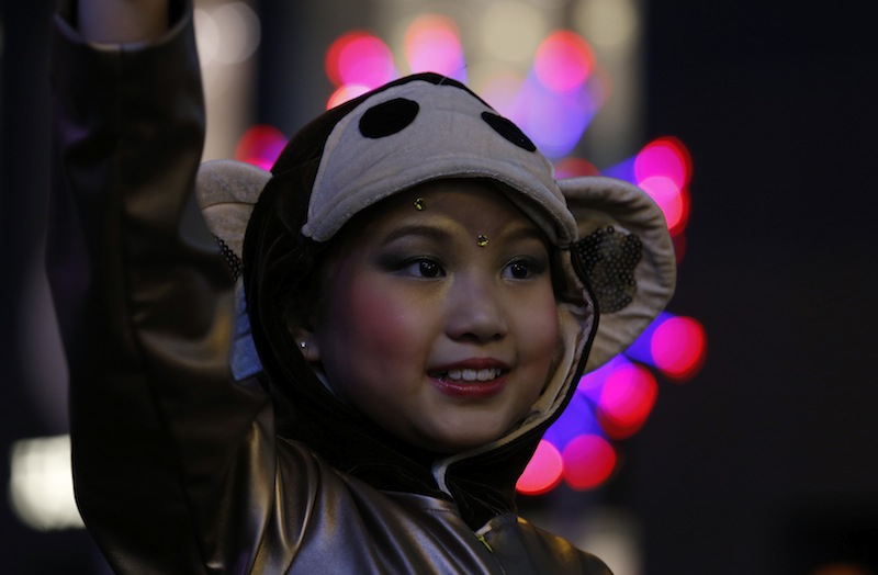 A young performer dressed as a monkey acknowledges spectators during a Lunar New Year parade celebrating the first day of the Lunar New Year of the Monkey in Hong Kong, China February 8, 2016. u00e2u20acu201du00c2u00a0Reuters pic