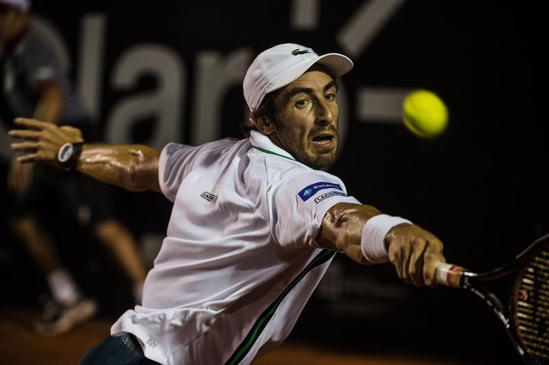 Pablo Cuevas of Uruguay plays against Guido Pella of Argentina during men's singles final match at the 2016 Rio Open tennis tournament in Rio de Janeiro, February 21, 2016. u00e2u20acu201d AFP pic