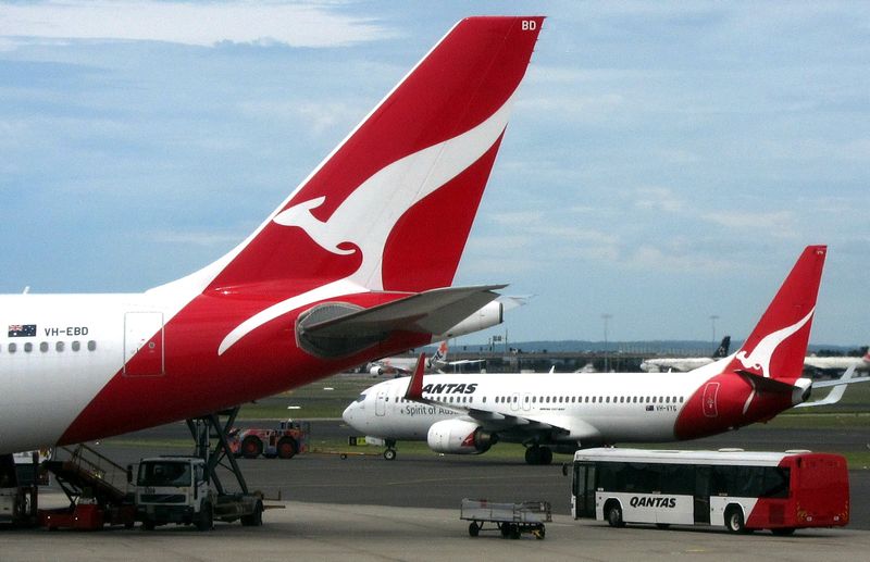 A Qantas Airways passenger bus drives near a Qantas Boeing 737-800 plane at the Sydney domestic terminal, November 12, 2015. u00e2u20acu201d Reuters pic