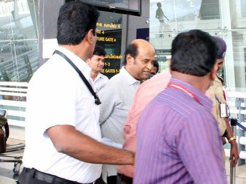 Superstar Rajinikanth is whisked away by security guards after arriving at KLIA yesterday. u00e2u20acu201d Facebook pic via CinemaOnline