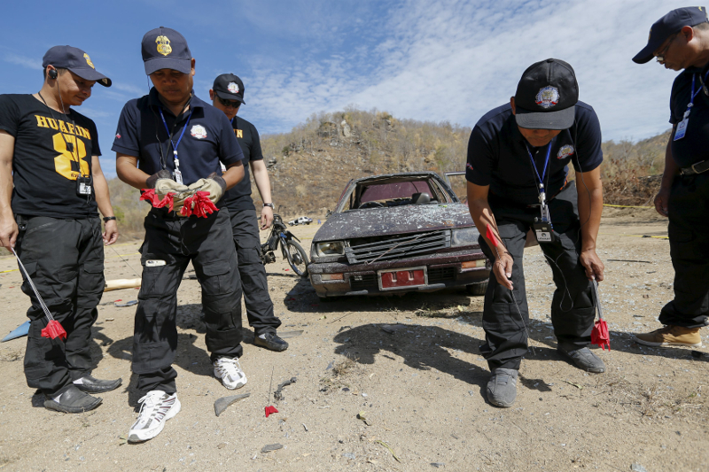 Police officers from Laos search for clues among the debris of a blast during a course on blast scene investigation near Hua Hin, Thailand January 18, 2016. u00e2u20acu201d Reuters pic