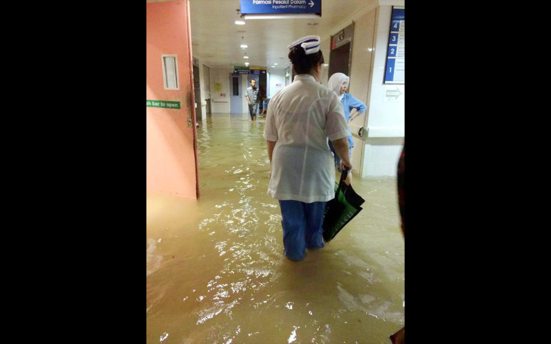 Several buildings including the Sarawak General Hospital and the Police Headquarters in Kuching are affected by flash floods after heavy rains hit the city of Kuching Feb 27, 2016. u00e2u20acu201d Bernama pic