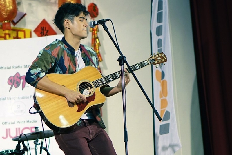 Singaporean singer-songwriter Nathan Hartono performing at the launch of the *SCAPE Invasion Tour at Canberra Secondary School. u00e2u20acu201d TODAY pic