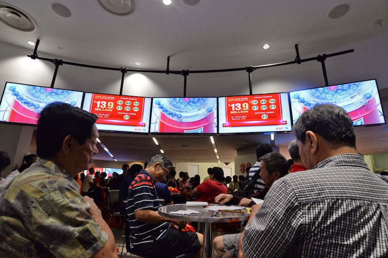 Punters at the Singapore Pools building awaiting the results of the Toto Hongbao Draw. u00e2u20acu201d TODAY pic