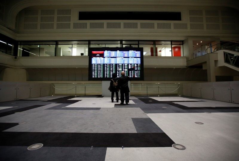 Visitors looks at an electronic board showing the Japan's Nikkei average at the Tokyo Stock Exchange (TSE) in Tokyo, February 9, 2016. u00e2u20acu201d AFP pic