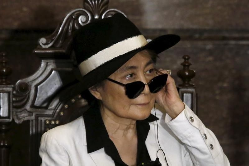 Artist Yoko Ono listens through an earpiece before she was honoured as 'Illustrious Visitor' by Mexico City's mayor Miguel Angel Mancera at Mexico City's town hall in Mexico City February 3, 2016. u00e2u20acu201d Reuters pic