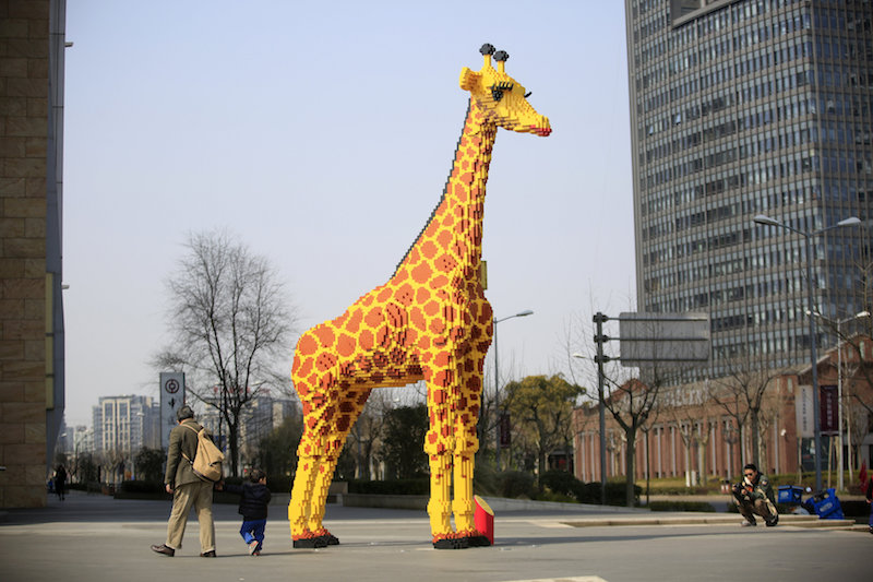 A 6.16-metre tall Lego giraffe is seen next to Shanghaiu00e2u20acu2122s Parkside Plaza March 1, 2016. u00e2u20acu201d Reuters picn