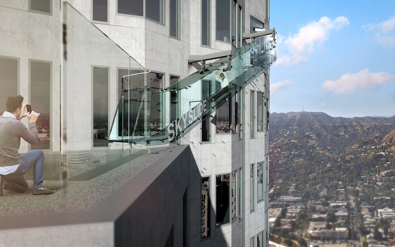 An artist rendering of the ‘Skyslide’ attraction, an outdoor glass slide positioned close to 1,000 feet above downtown Los Angeles, California, is shown in this image released by OUE Skyspace on March 2, 2016. — Handout via Reuters