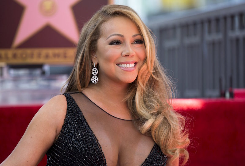 Recording artist Mariah Carey poses on her star after it was unveiled on the Hollywood Walk of Fame in Los Angeles, California, in this August 5, 2015 file photo. u00e2u20acu201d Reuters pic