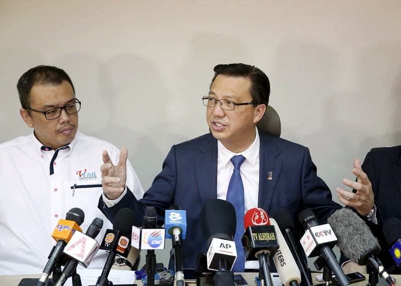 Transport minister Datuk Seri Liow Tiong Lai (right) speaks at a news conference about debris found on a beach in Mozambique that may be from missing Malaysia Airlines flight MH370, in Kuala Lumpur on March 3, 2016. u00e2u20acu201d Reuters pic