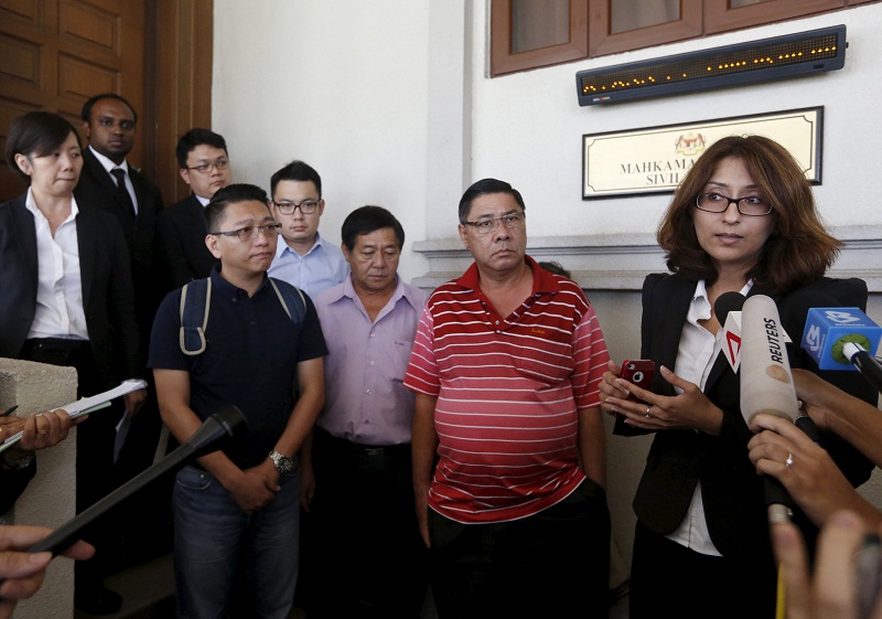 File picture of Lawyer Sangeet Deo (right) speaking to members of the media, accompanied by relatives of passengers Tan Ah Meng, his wife Chuang Hsiu Ling, and son Tan Wei Chew, who were aboard the missing Malaysia Airlines flight MH370. u00e2u20acu201d Reuters pic 