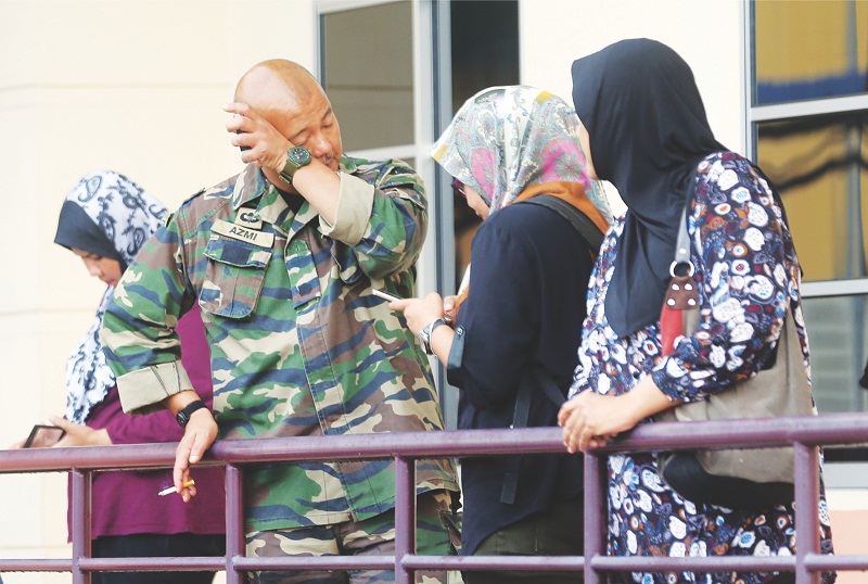 Azmi searched for his mother Rosmani, his brother and nephews for hours before the gruesome discovery. u00e2u20acu201d Picture by Farhan Najib