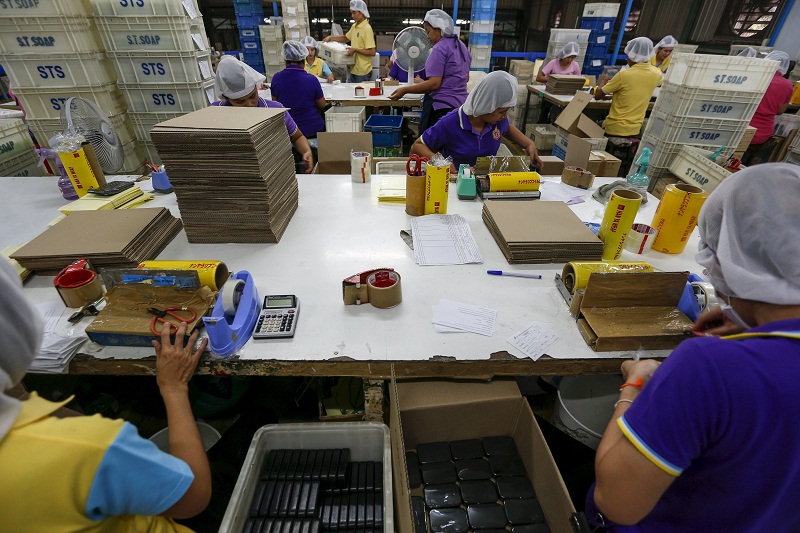 Workers wrap soap bars at a STS Consumer Product factory in Bangkok, Thailand, March 28, 2016. u00e2u20acu201d Reuters pic