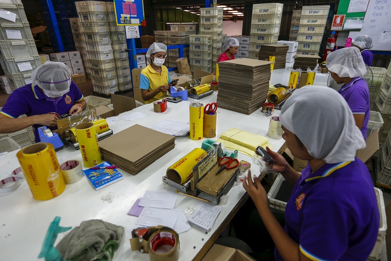Workers wrap soap bars at a STS Consumer Product factory in Bangkok, Thailand, March 28, 2016. u00e2u20acu201d Reuters pic