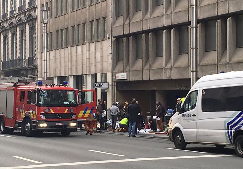 Emergency services take care of wounded people outside the Maalbeek metro station in Brussels on March 21, 2016 after a blast at this station located near the EU institutions. u00e2u20acu2022 AFP pic