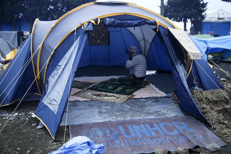 A man prays inside a worship area in a tent at a camp for refugees and migrants at the Greek-Macedonian border near the village of Idomeni, Greece, March 17, 2016. u00e2u20acu201d Reuters pic