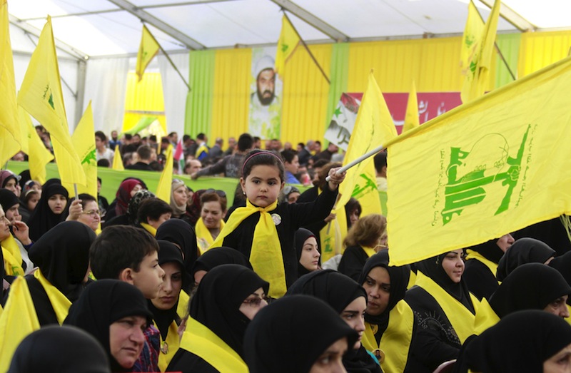 A girl waves a Hezbollah flag during a commemoration service in Ansar village, southern Lebanon March 6, 2016. u00e2u20acu201d Reuters pic